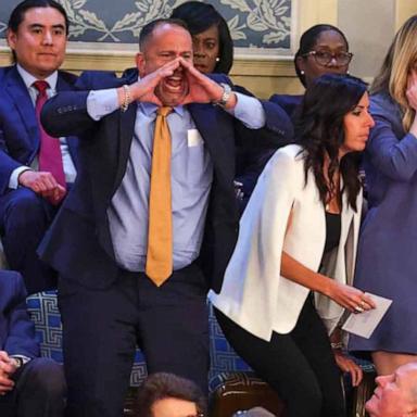 Late into Biden's remarks, a man was removed from the upper area of the House chamber after shouting out repeatedly.