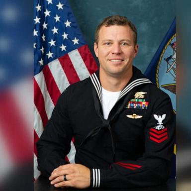 A Navy investigation released Friday blames heavy gear for the deaths of two SEALs who drowned during a nighttime boat raid off the coast of Somalia in January.