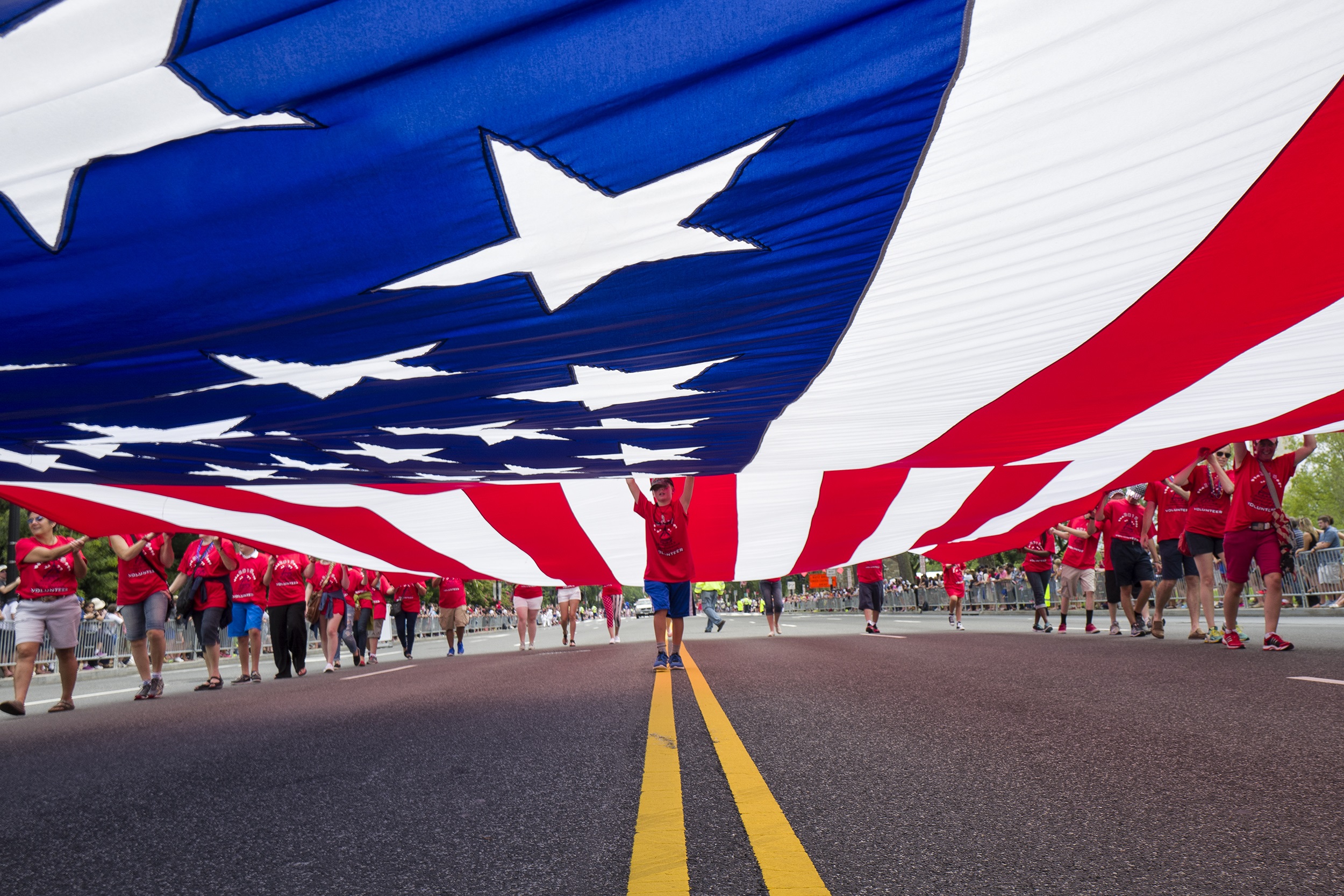 PHOTO: A massive flag is carried along the Independence Day Parade route in Washington, July 4, 2015. 