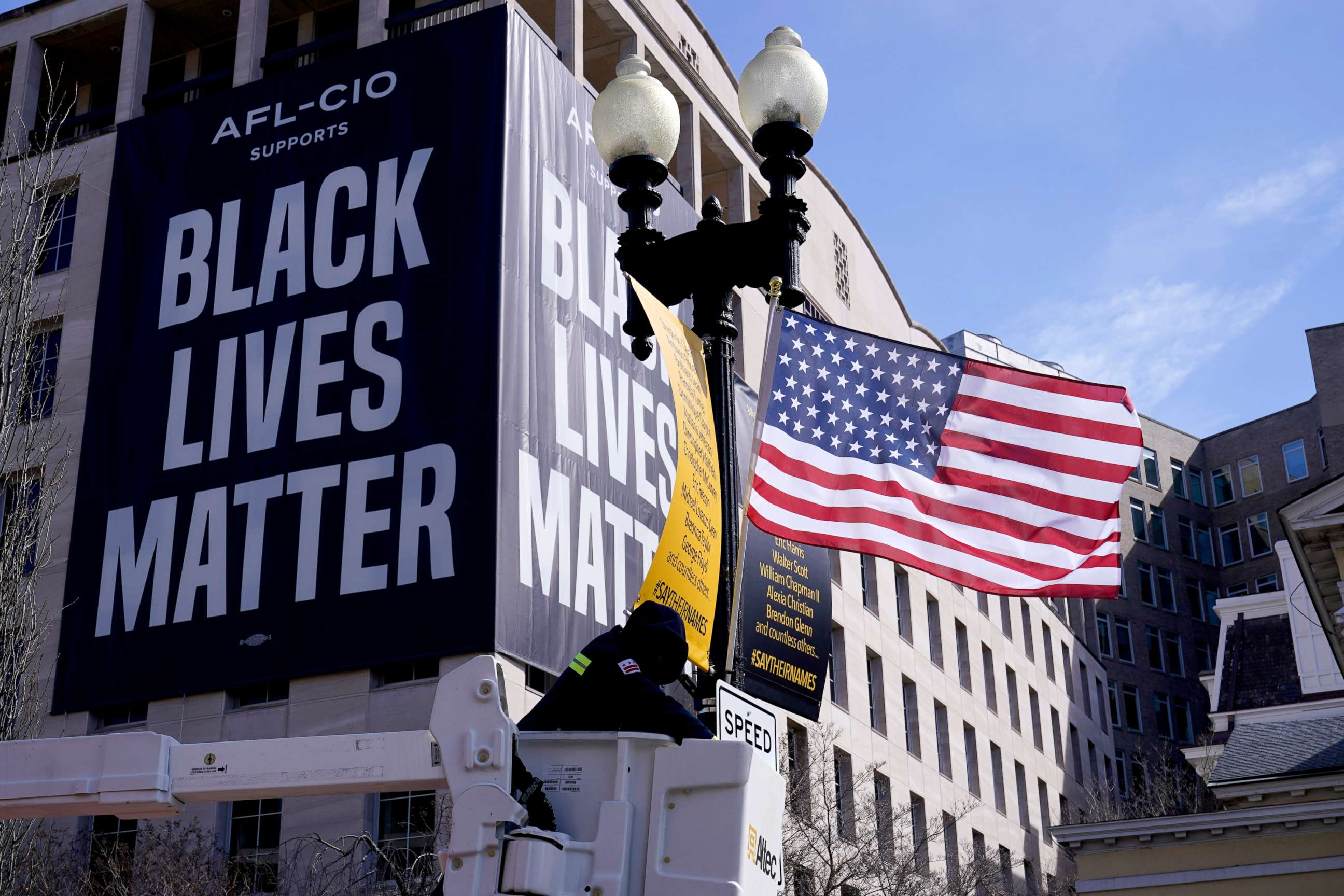 PHOTO: A flag is hung on Black Lives Matter Plaza in Washington, March 19, 2021, ahead of testimony next week by Washington, D.C., Mayor Muriel Bowser on D.C. statehood.
