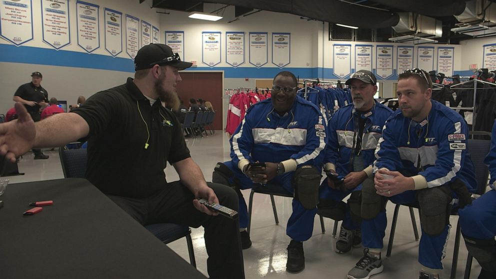 PHOTO: United Airlines employees receive pit crew instruction.