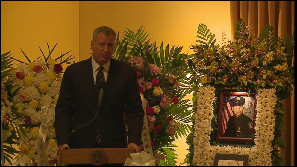 PHOTO: Mayor Bill De Blasio delivers remarks at the funeral for New York City police officer Wenjian Liu on Sunday, Jan. 4, 2015.