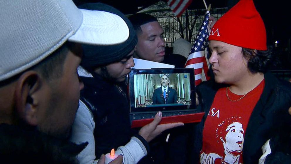 PHOTO: Immigration protesters watch President Obama address the nation on his proposed reform, Nov. 20, 2014, in Washington.