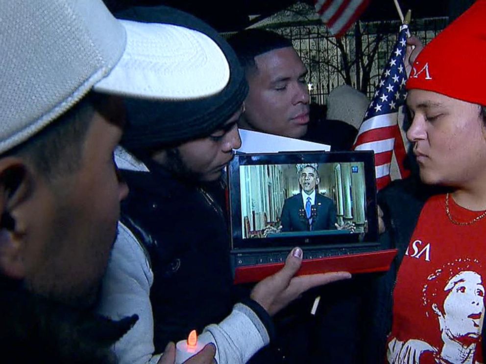 PHOTO: Immigration protesters watch President Obama address the nation on his proposed reform, Nov. 20, 2014, in Washington.
