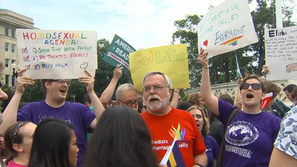 Both Sides of the Same-Sex Marriage Case Duel With Signs and Slogans  Outside the Supreme Court