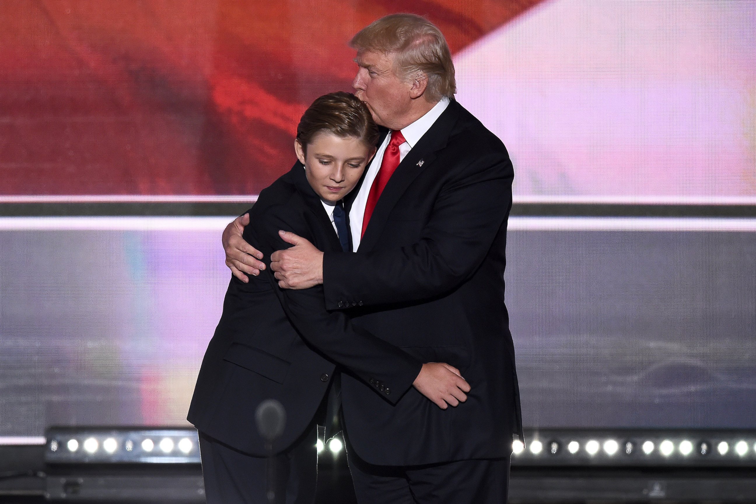 PHOTO: Republican presidential candidate Donald Trump kisses his son Barron Trump during celebrations after Trump's acceptance speech on the final day of the Republican National Convention at the Quicken Loans Arena in Cleveland, on July 21, 2016. 