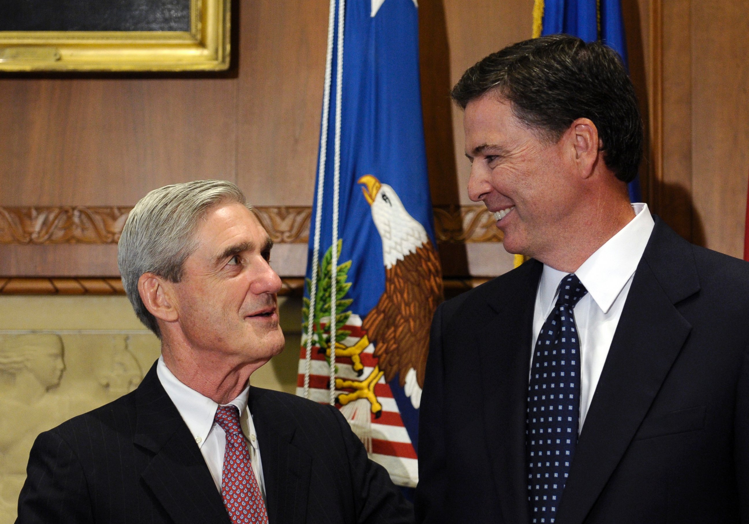 PHOTO: A Sept.4, 2013 file photo showing incoming FBI Director James Comey, right, talking with retiring FBI Director Robert Mueller at the Justice Department in Washington,D.C.  