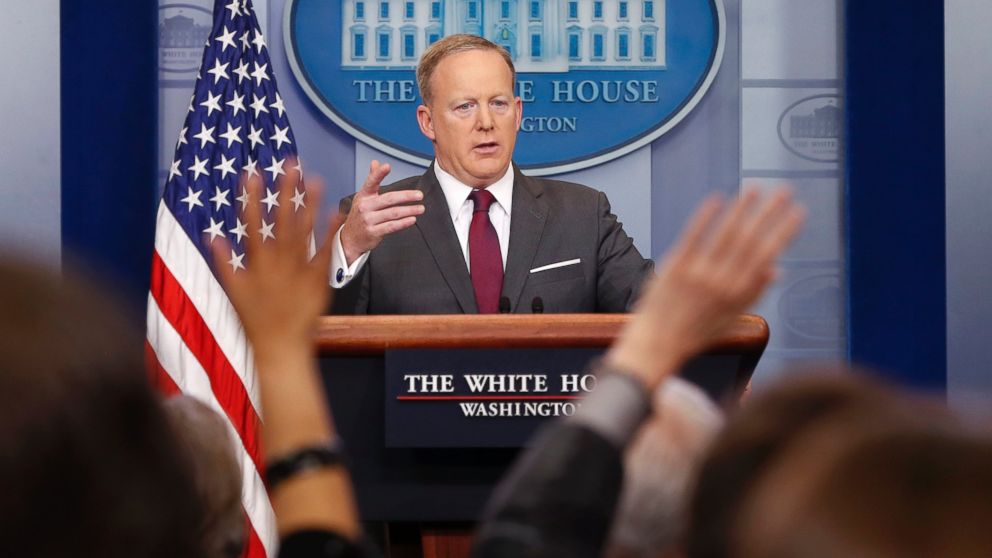 Members of the media raise their hands as White House Press secretary Sean Spicer answers questions during the daily briefing in the Brady Press Briefing Room of the White House  April 24, 2017, in Washington.