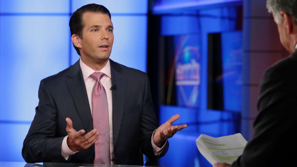 Donald Trump Jr., left, is interviewed by host Sean Hannity on his Fox News Channel television program, in New York, July 11, 2017. Donald Trump Jr. eagerly accepted help from what was described to him as a Russian government effort to aid his father's campaign with damaging information about Hillary Clinton, according to emails he released publicly on Tuesday.