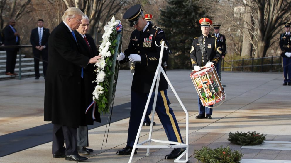 PHOTO: President-elect Donald Trump, accompanied by Vice President-elect Mike Pence places a wreath at the Tomb of the Unknowns, Jan. 19, 2017, at Arlington National Cemetery in Arlington, Va.