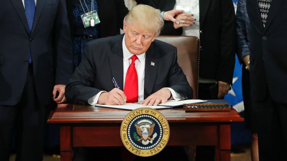PHOTO: President Donald Trump signs an executive order for border security and immigration enforcement improvements at the Department of Homeland Security in Washington, Jan. 25, 2017.