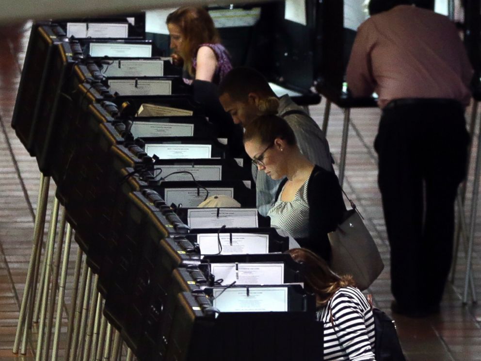 PHOTO: In this Oct. 24, 2016 file photo, people vote at a polling station on the first day of early voting in Miami-Dade County for the general election in Miami.