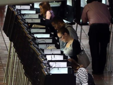 PHOTO: In this Oct. 24, 2016 file photo, people vote at a polling station on the first day of early voting in Miami-Dade County for the general election in Miami.