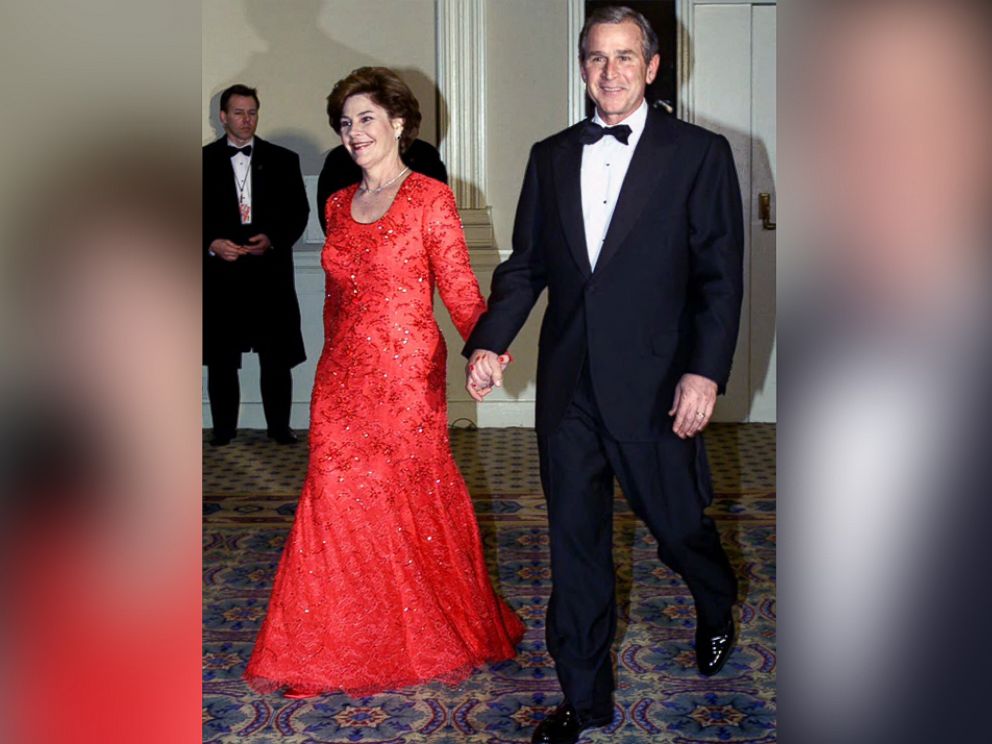 PHOTO: George W. Bush and Laura Bush smile as they are welcomed by supporters at the Salute to Heroes and Veterans Banquet in Washington, Jan. 20, 2001.