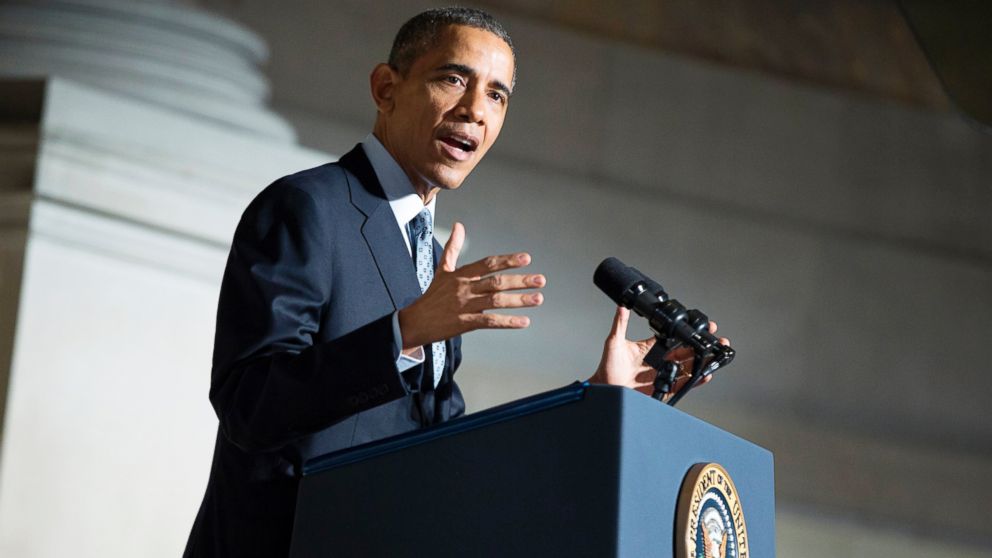 Former President Barack Obama speaks during a naturalization ceremony at the National Archives, Dec. 15, 2015, in Washington.