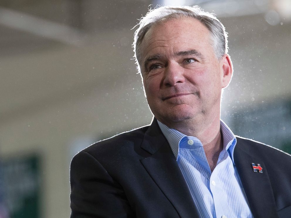 PHOTO: Democratic vice presidential candidate Sen. Tim Kaine listens as Democratic presidential candidate Hillary Clinton speaks during a campaign event at the Taylor Allderdice High School, Oct. 22, 2016, in Pittsburgh, Pennsylvania.