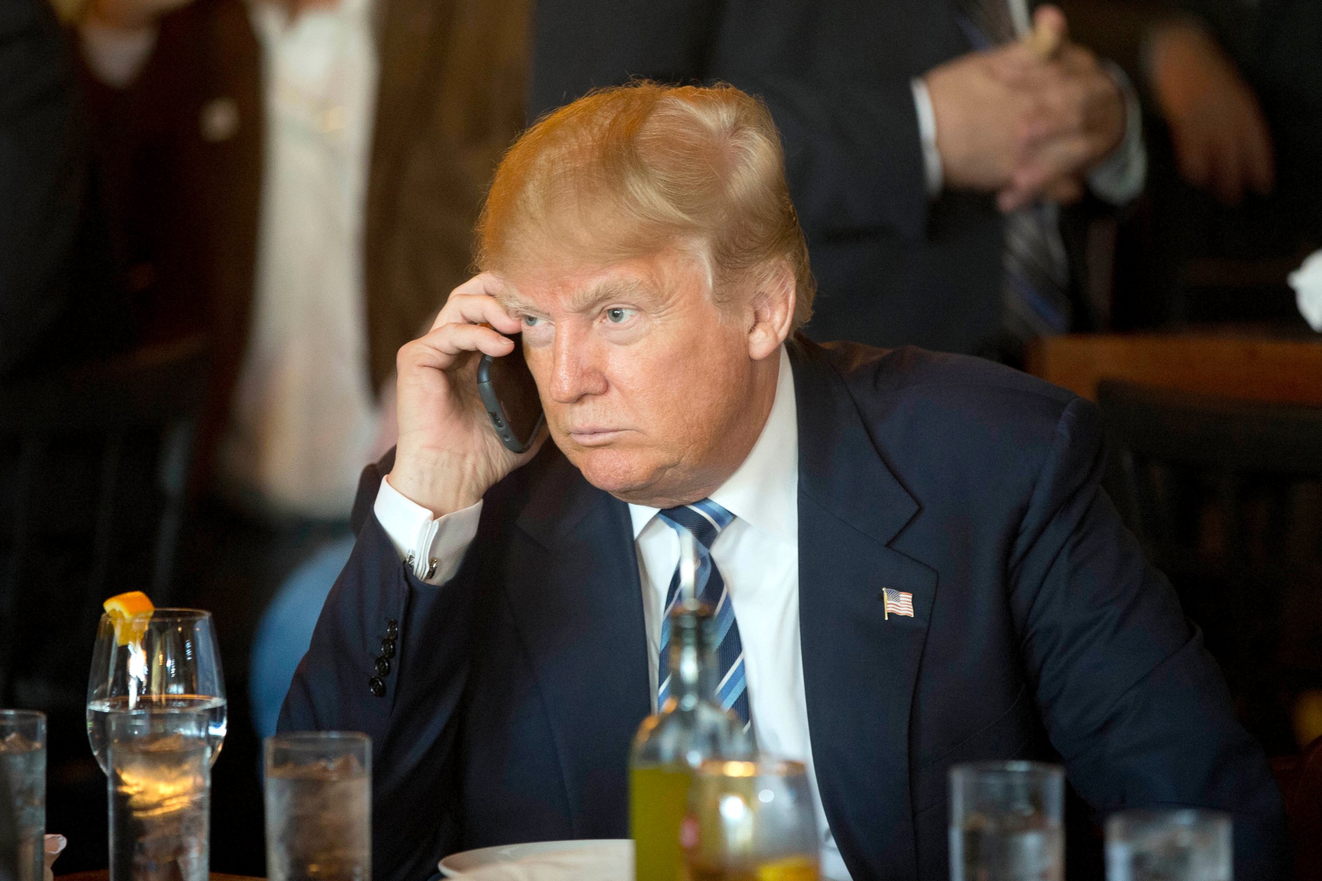 PHOTO: Donald Trump listens to his mobile phone during a lunch stop in North Charleston, S.C., Feb. 18, 2016. 