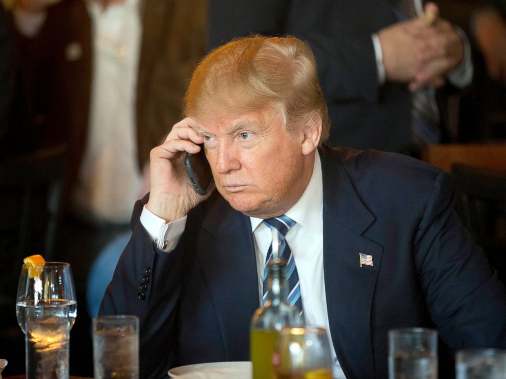 PHOTO: Donald Trump listens to his mobile phone during a lunch stop in North Charleston, S.C., Feb. 18, 2016.