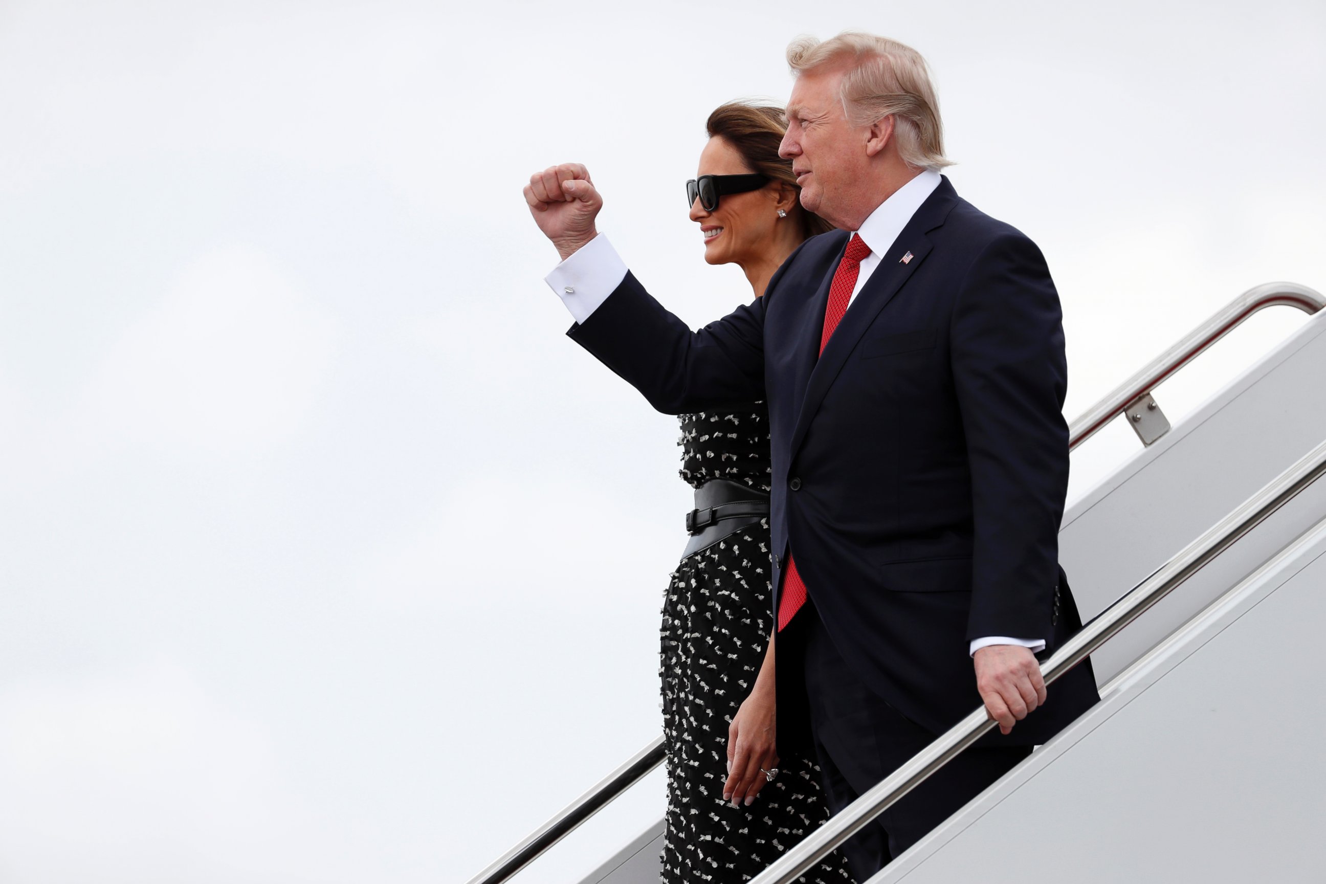 PHOTO: President Donald Trump and first lady Melania Trump walk down the stairs of Air Force One as they arrive at the Palm Beach International Airport, April 6, 2017, in West Palm Beach, Fla., en route to Mar-a-Largo.