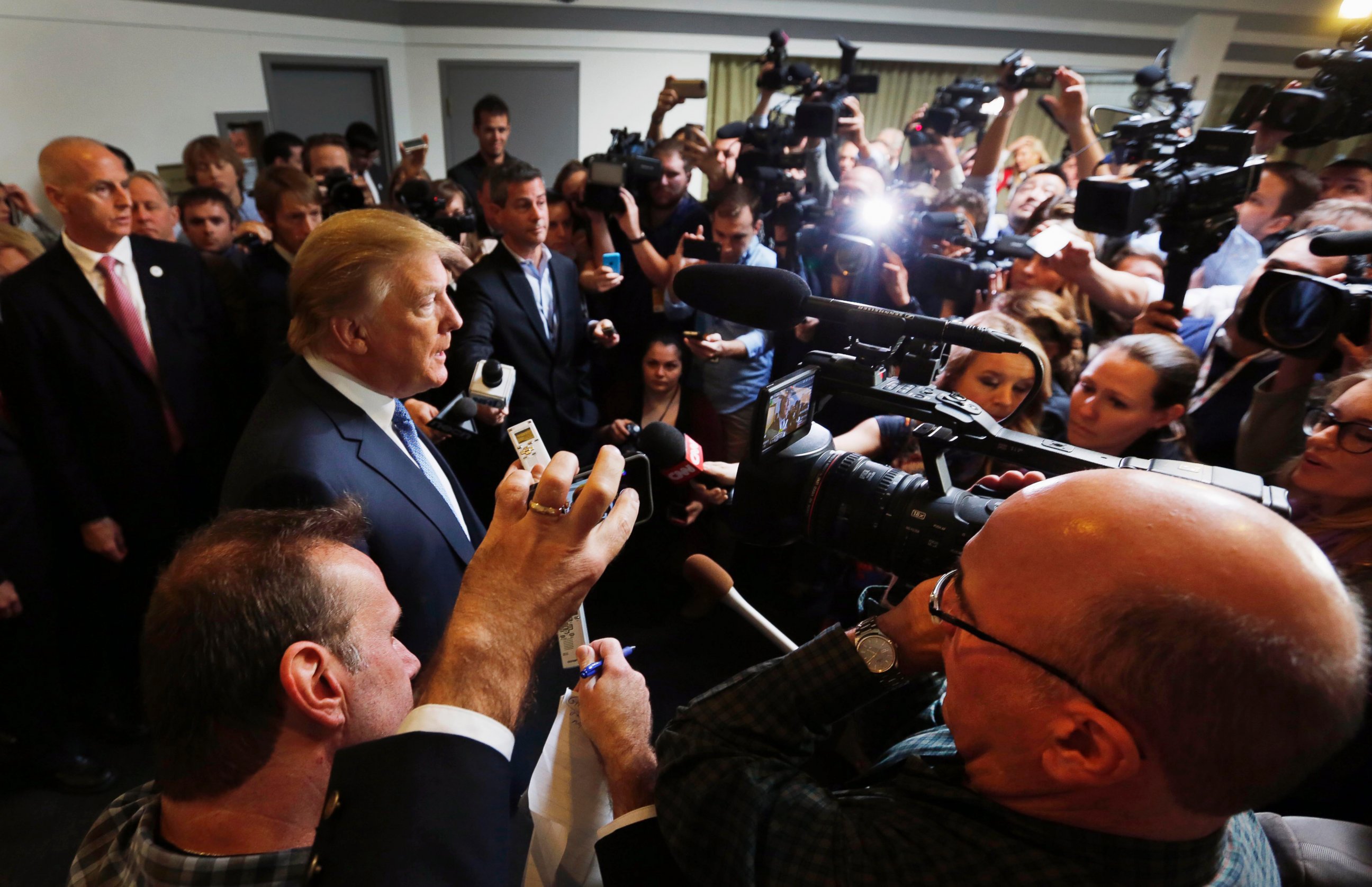 PHOTO: Donald Trump talks with reporters as he arrives to speak at a No Labels Problem Solver convention, Oct. 12, 2015, in Manchester, New Hampshire. 