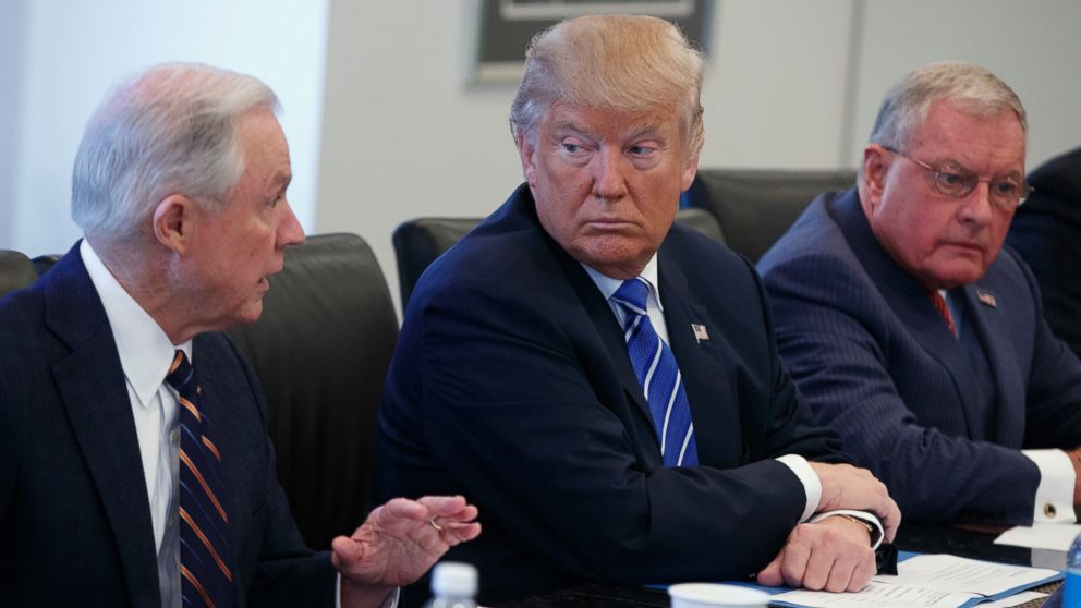Donald Trump, center, and retired Gen. Keith Kellogg, right, listen as Sen. Jeff Sessions speaks during a national security meeting with advisors at Trump Tower, Oct. 7, 2016, in New York. 