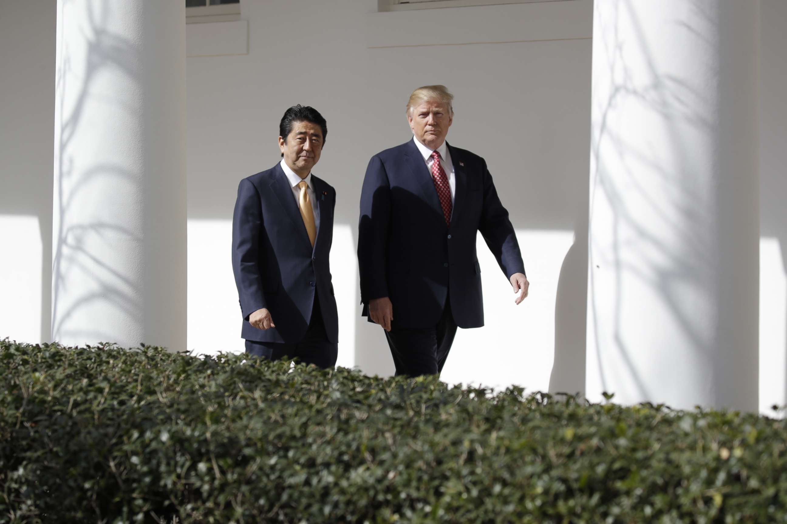 PHOTO: Donald Trump walks with Japanese Prime Minister Shinzo Abe at the White House in Washington, Feb. 10, 2017.