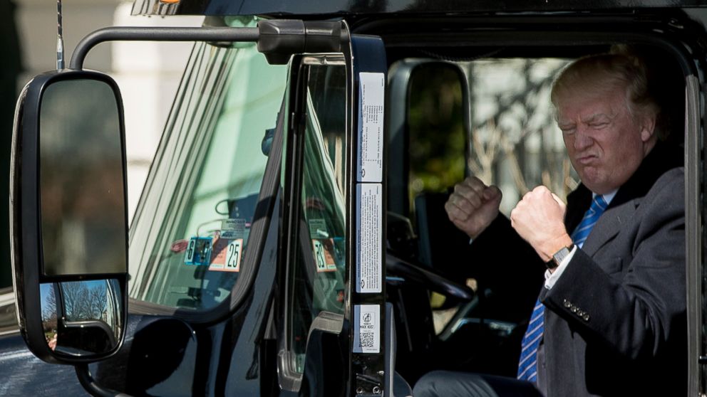 PHOTO: President Donald Trump gestures while sitting in an 18-wheeler truck while meeting with truckers and CEOs regarding healthcare on the South Lawn of the White House in Washington, March 23, 2017.