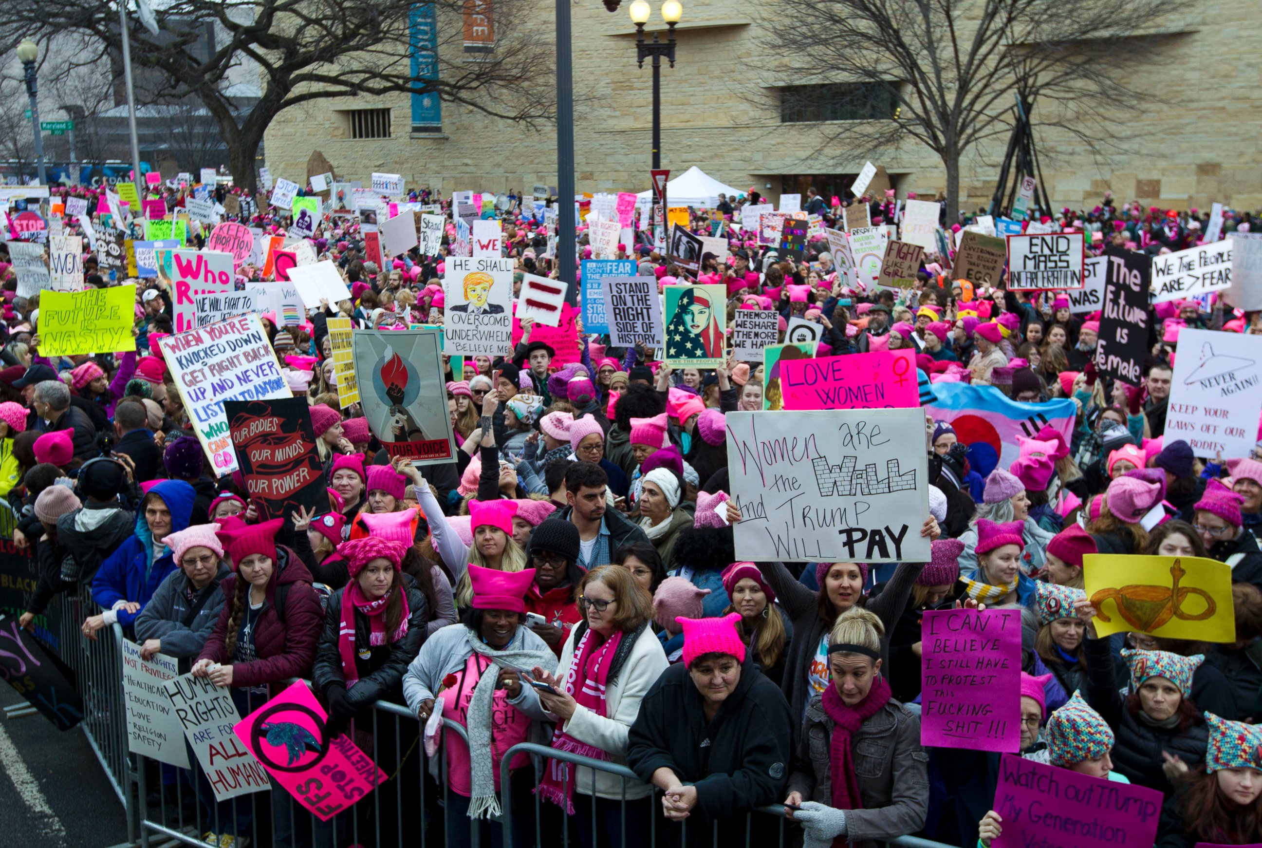 PHOTO: Women with bright pink hats and signs begin to gather early and are set to make their voices heard on the first full day of Donald Trump's presidency, Jan. 21, 2017 in Washington. 