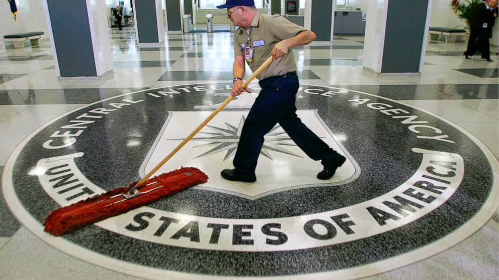 A workman slides a mop over the floor at the Central Intelligence Agency headquarters in Langley, Va, March 3, 2005. 