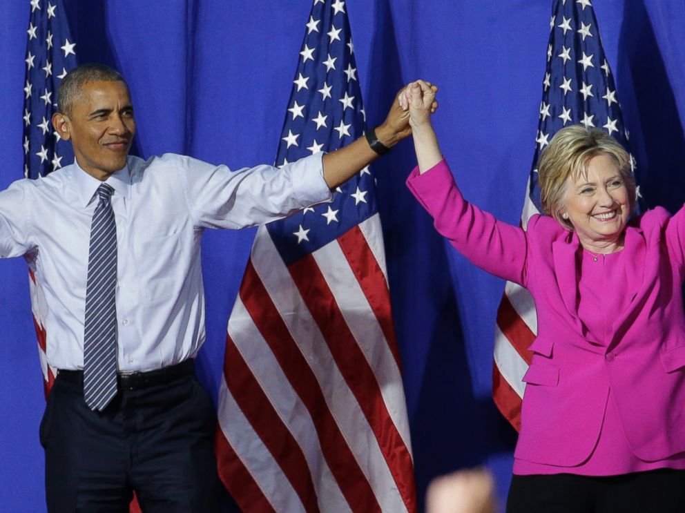 PHOTO: President Barack Obama and Democratic presidential candidate Hillary Clinton wave to the crowd during a campaign rally for Clinton in Charlotte, North Carolina, July 5, 2016. 
