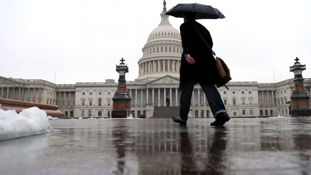 A person walks on Capitol Hill in Washington, Dec. 9, 2013.