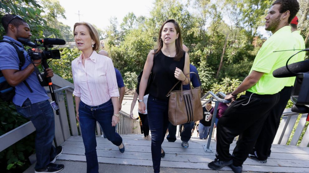 PHOTO: Republican presidential candidate Carly Fiorina walks with her assistant Rebecca Schieber, right, before a University of Iowa football game in Iowa City, Iowa in this Sept. 26, 2015 file photo.
