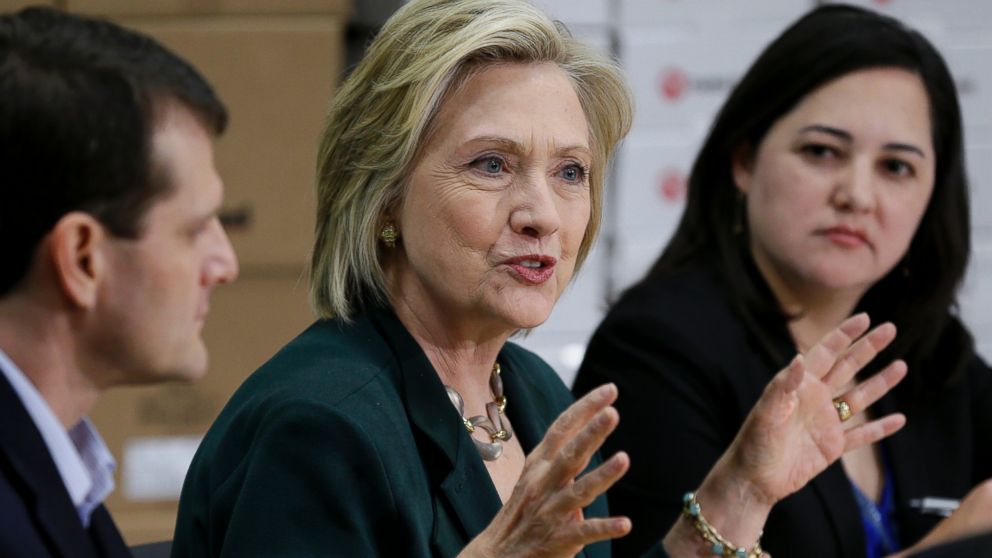 Democratic presidential candidate Hillary Rodham Clinton, center, speaks during a small business roundtable, Wednesday, April 15, 2015, in Norwalk, Iowa. 