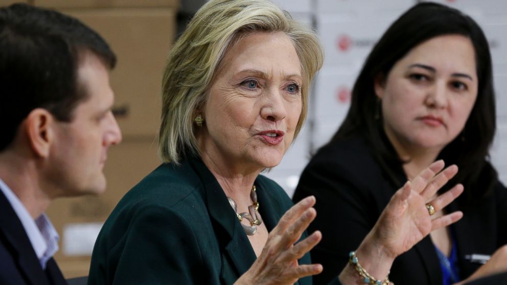 Democratic presidential candidate Hillary Rodham Clinton, center, speaks during a small business roundtable, Wednesday, April 15, 2015, in Norwalk, Iowa.