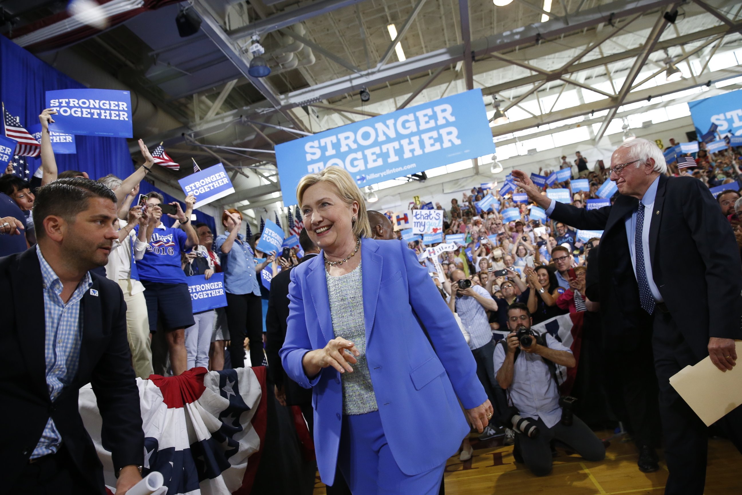PHOTO: Democratic presidential candidate Hillary Clinton, followed by Sen. Bernie Sanders, I-Vt. arrives for a rally in Portsmouth, N.H., July 12, 2016. 