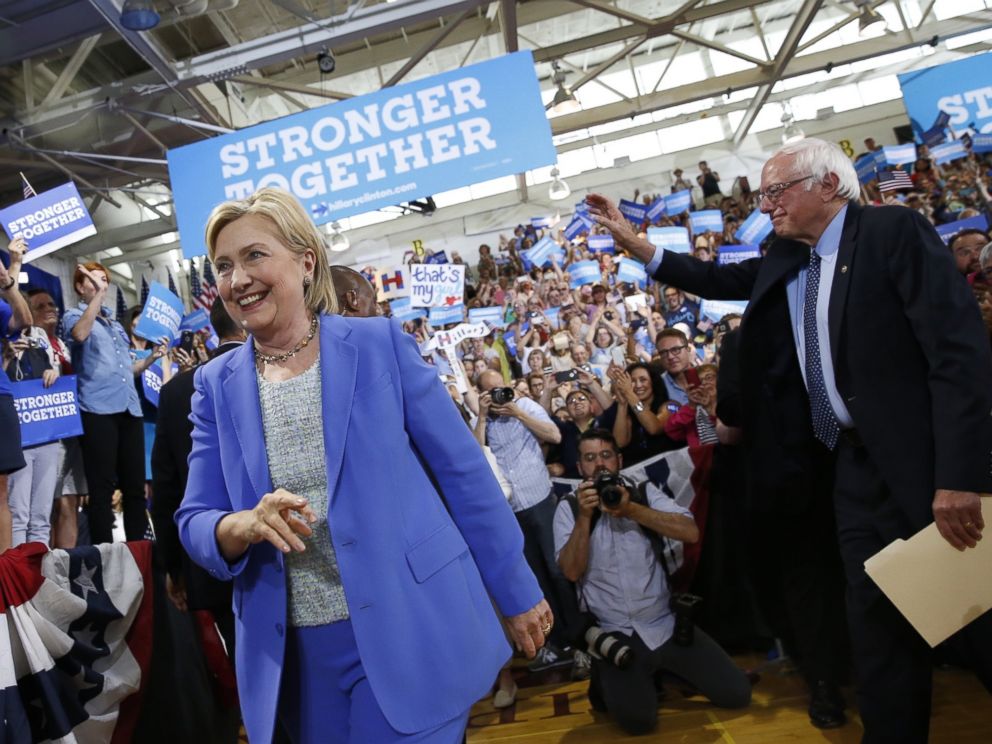 PHOTO: Democratic presidential candidate Hillary Clinton, followed by Sen. Bernie Sanders, I-Vt. arrives for a rally in Portsmouth, N.H., July 12, 2016.