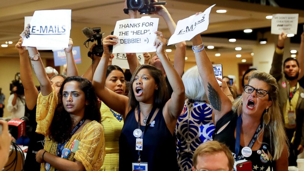 Protesters yell as DNC Chairwoman, Debbie Wasserman Schultz, D-Fla., arrives for a Florida delegation breakfast, July 25, 2016, in Philadelphia, during the first day of the Democratic National Convention.