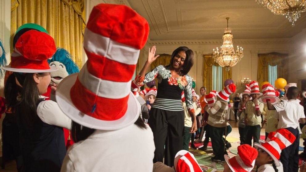 First lady Michelle Obama greets local students after reading to them as part of her "Let's Move, Let's Read!" initiative, Wednesday, Jan. 21, 2015, in the East Room of the White House in Washington.