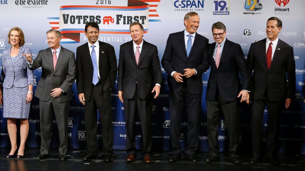 Republican presidential candidates gather on stage before a forum, Aug. 3, 2015, in Manchester, N.H.