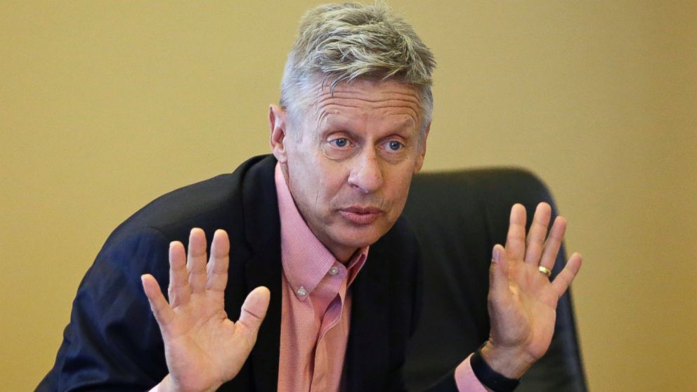 Libertarian candidate and former New Mexico Gov. Gary Johnson speak with legislators at the Utah State Capitol, May 18, 2016, in Salt Lake City.