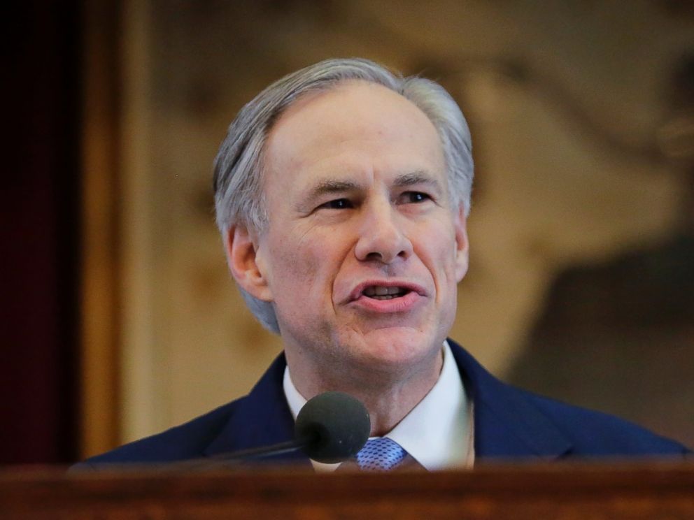 PHOTO: Texas Gov. Greg Abbott holds a book about Texas school laws as he delivers his State of the State address to a joint session of the House and Senate, Tuesday, Feb. 17, 2015, in Austin, Texas.