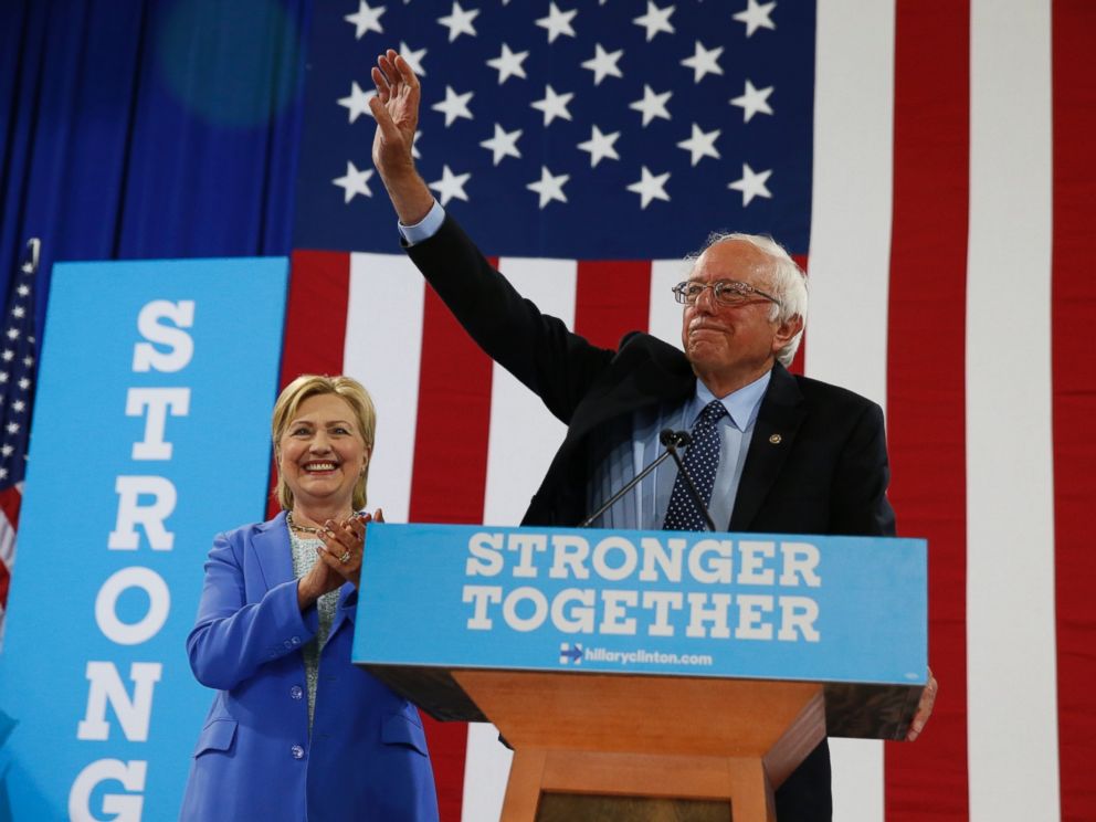 PHOTO: Sen. Bernie Sanders waves as he and Democratic presidential candidate Hillary Clinton arrive for a rally in Portsmouth, New Hampshire, July 12, 2016.