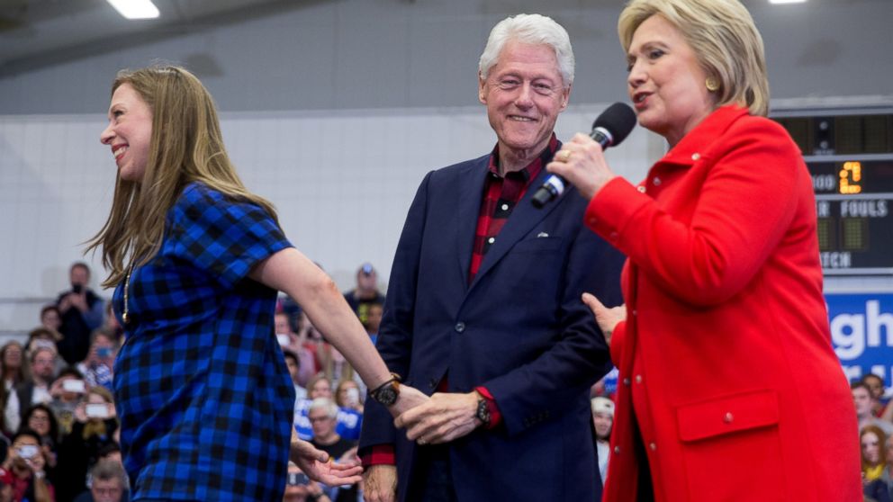 Former President Bill Clinton, center, and daughter Chelsea Clinton step off the stage as Democratic presidential candidate Hillary Clinton arrives to speak at a rally at Washington High School in Cedar Rapids, Iowa, Saturday, Jan. 30, 2016.