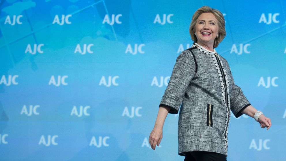 Former Secretary of State Hillary Rodham Clinton walks onstage to address the American Jewish Committee (AJC) Global Forum closing plenary in Washington, Wednesday, May 14, 2014. 