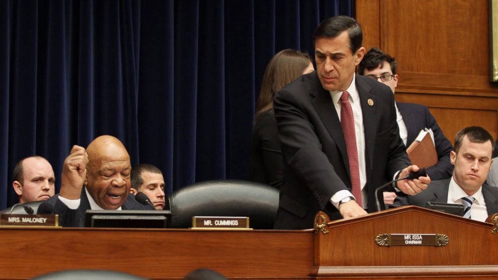 House Oversight and Government Reform Committee Chairman Rep. Darrell Issa, R-Calif., right, leaves as the committee's ranking member Rep. Elijah Cummings, D-Md., left, begins his statement on Capitol Hill in Washington, March 5, 2014. 