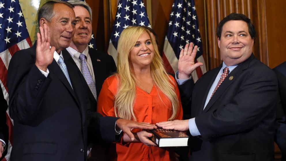 House Speaker John Boehner of Ohio poses for a photo with Rep. Blake Farenthold, right, accompanied by family, to re-enact the House oath-of-office, in this  Jan. 6, 2015 file photo on Capitol Hill in Washington. 