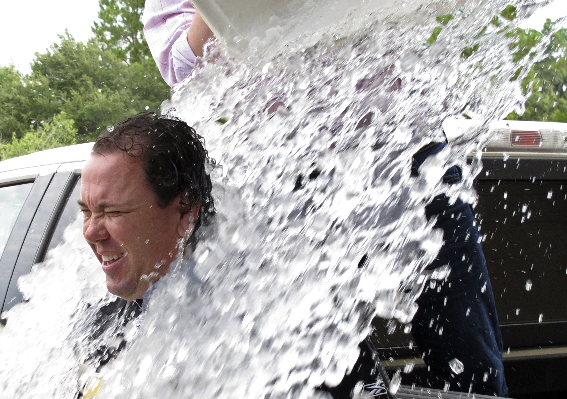 PHOTO: U.S. Rep. Vance McAllister is doused as he takes the strikeout ALS ice bucket challenge after qualifying for his re-election bid Friday, Aug. 22, 2014, in Baton Rouge, La. 