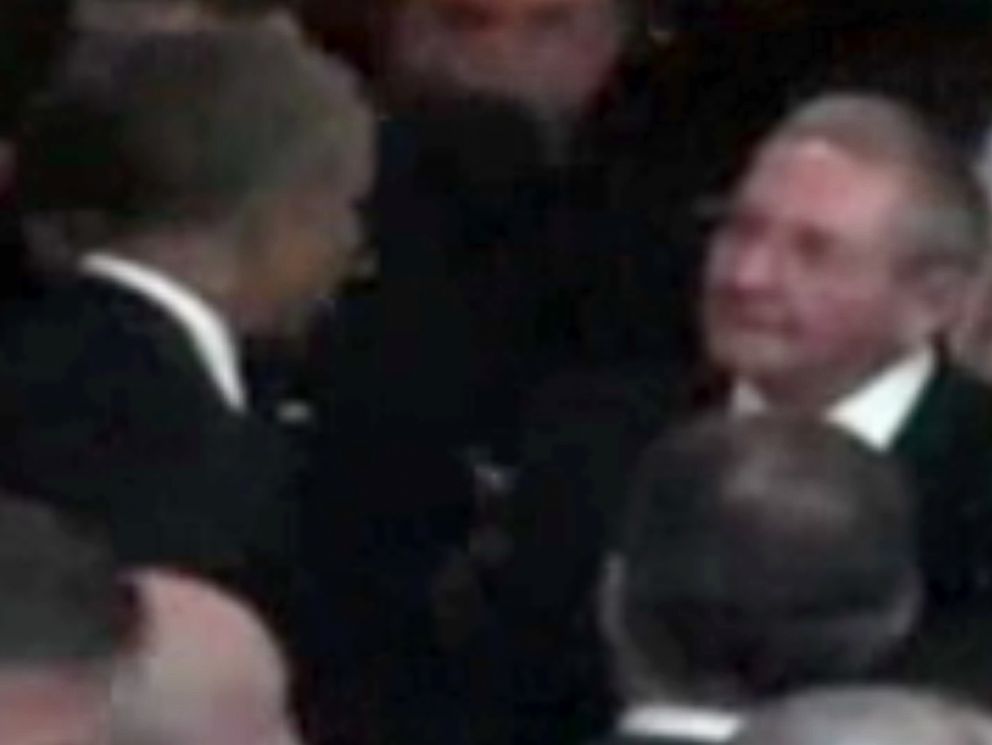 This image from Telesur video shows President Obama sharing a cordial evening handshake with Cuban President Raul Castro during a meeting on the sidelines of the Summit of the Americas Friday evening April 10, 2015 in Panama City, Panama.