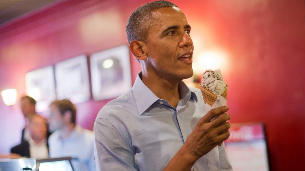 President Obama holds his ice cream cone during a visit to Grand Ole Creamery in St. Paul, Minn., June 26, 2014.   