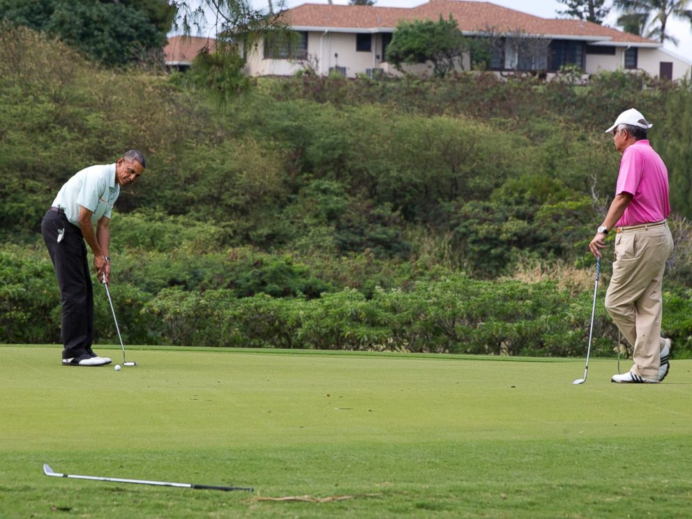 President Barack Obama plays golf with Malaysian Prime Minister Najib Razak, right, Wednesday, Dec. 24, 2014, at Marine Corps Base Hawaiis Kaneohe Klipper Golf Course in Kaneohe, Hawaii during the Obama family vacation.